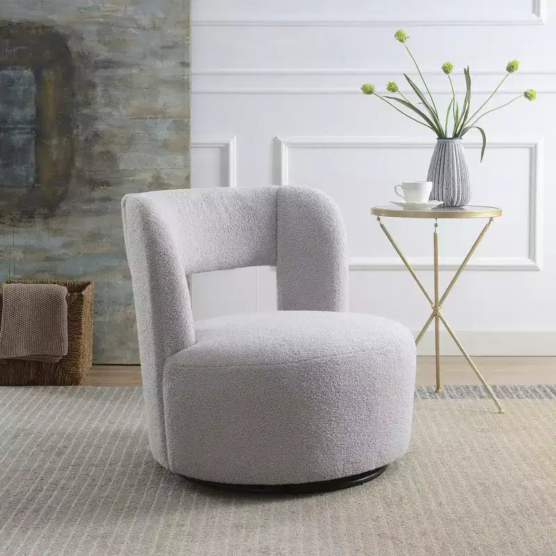 Poltrona girevole a 360° con rivestimento "Teddy" nei colori crema, grigio o rosa, seduta singola