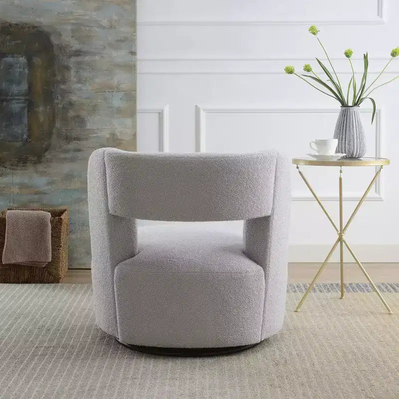 Poltrona girevole a 360° con rivestimento "Teddy" nei colori crema, grigio o rosa, seduta singola