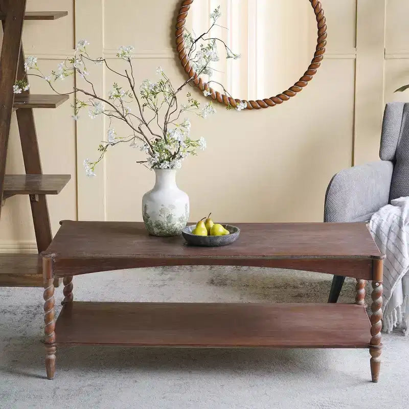 Tavolino da salotto GDFStudio Ottilia in legno rustico con gambe a spirale tornite e ripiano inferiore
